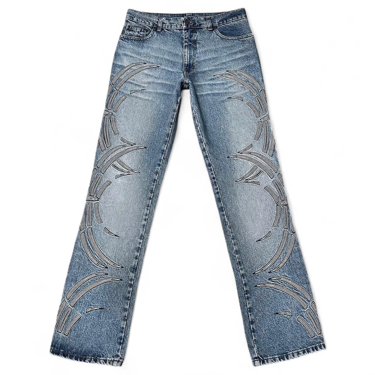 Curved tattoo embroidery blue jeans