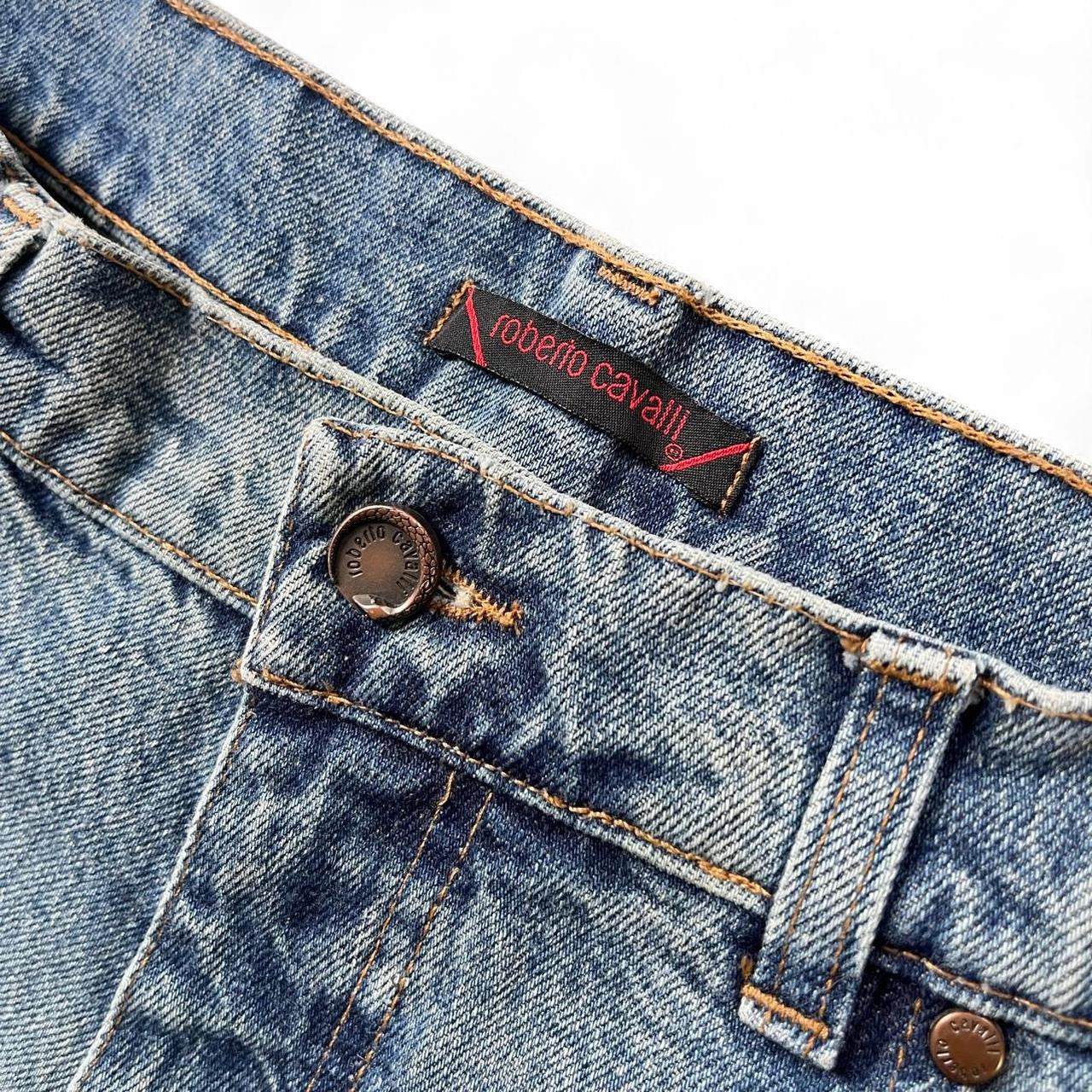 Curved tattoo embroidery blue jeans
