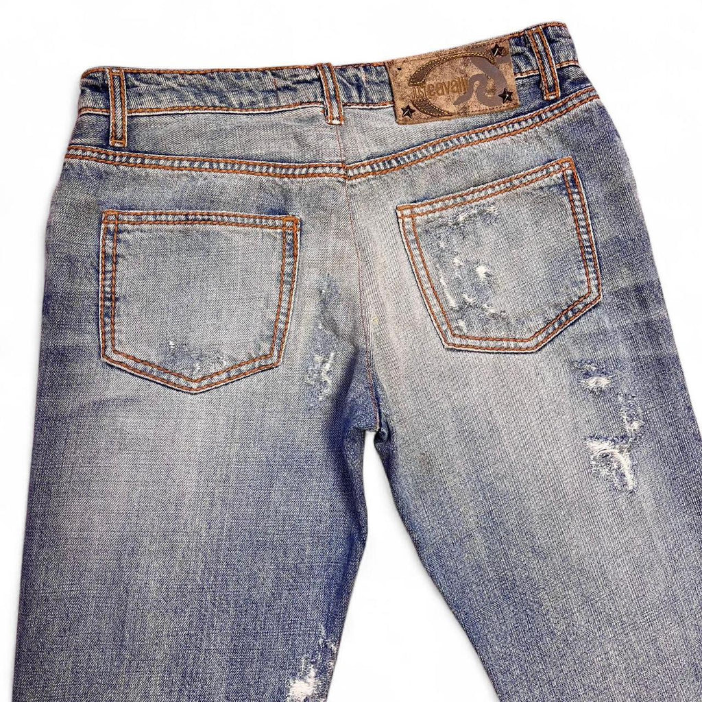 Distressed copper appliqué jeans