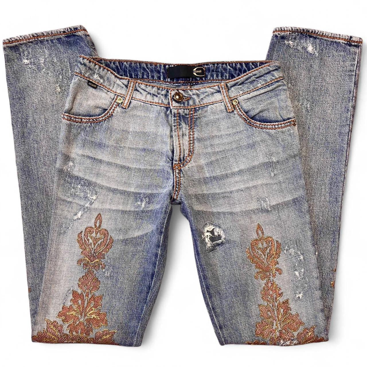 Distressed copper appliqué jeans